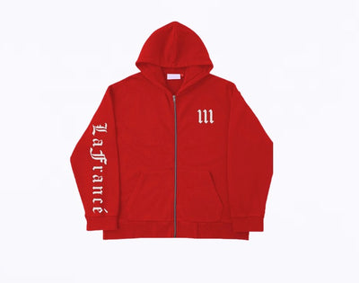 Close up image of the front of a red zip-up jacket with "111" and "Lafrance" in white Old English font