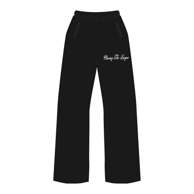 Close up picture of the front of black sweatpants with "Chasing the league" written in a white cursive font on upper left leg of pant