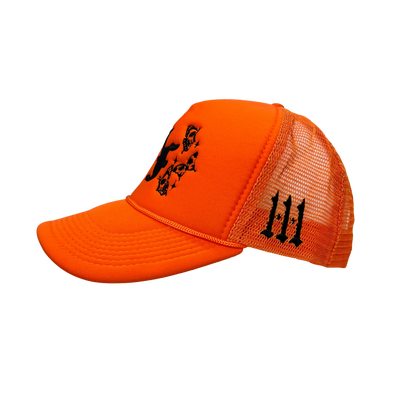 Close up image of the side of orange trucker hat with black font