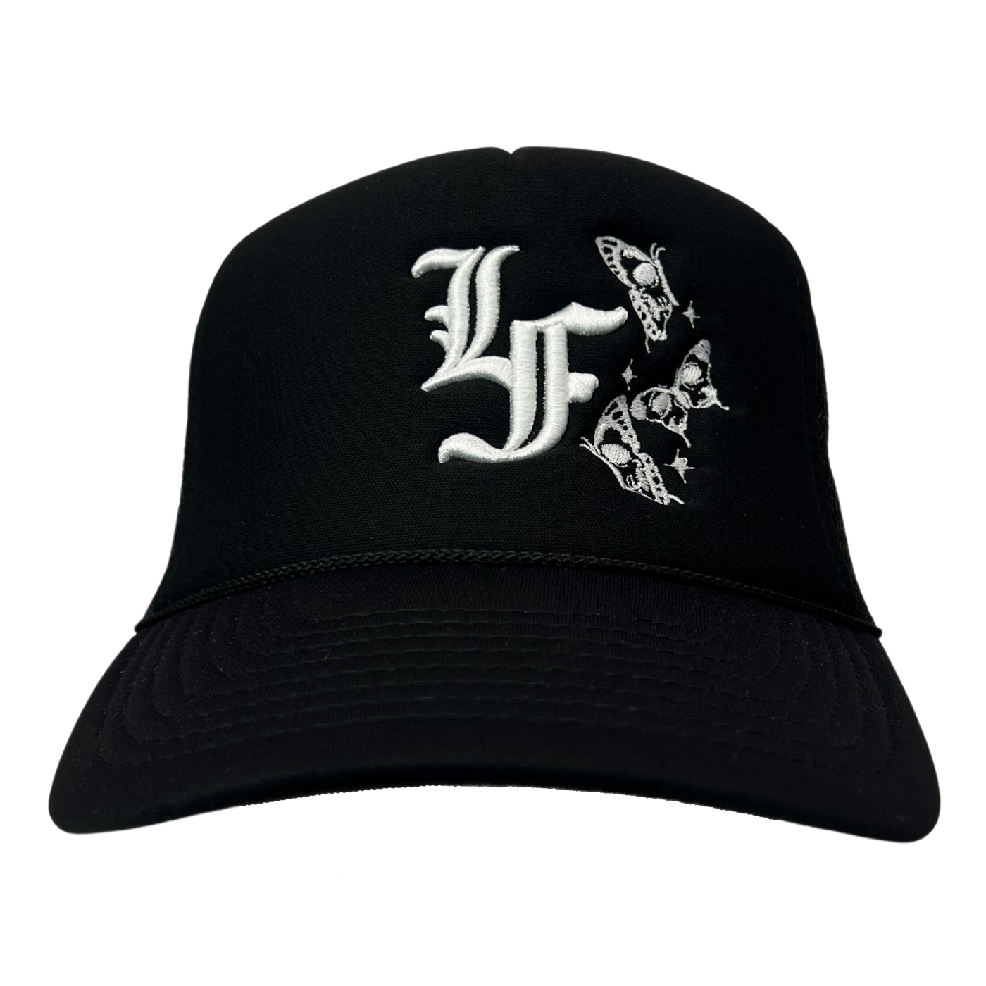 Close up image of the front of black trucker hat with white font