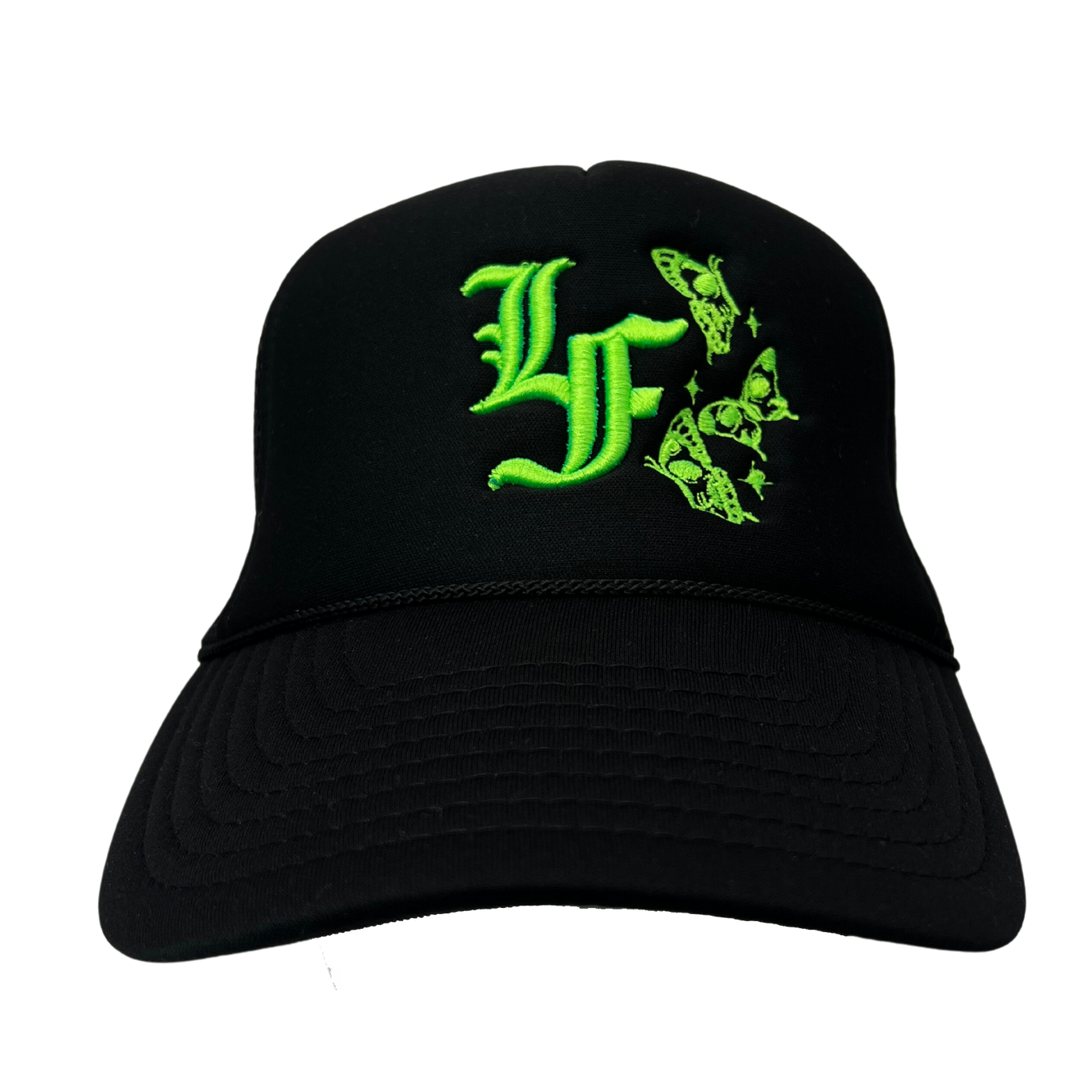 Close up image of the front of black trucker hat with green font