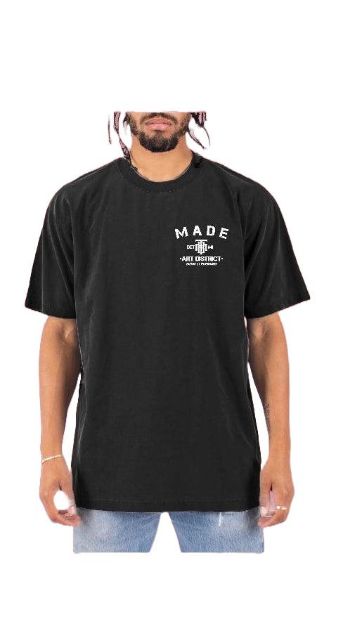 Front of black t-shirt with Taylor Made logo in right hand corner