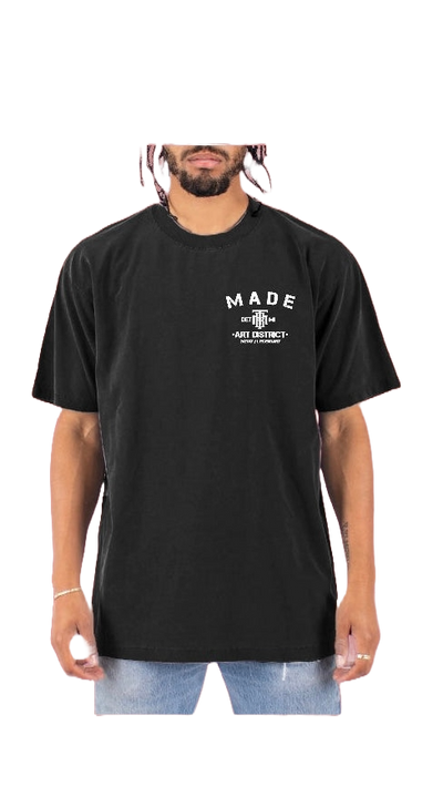 Front of black t-shirt with Taylor Made logo in right hand corner